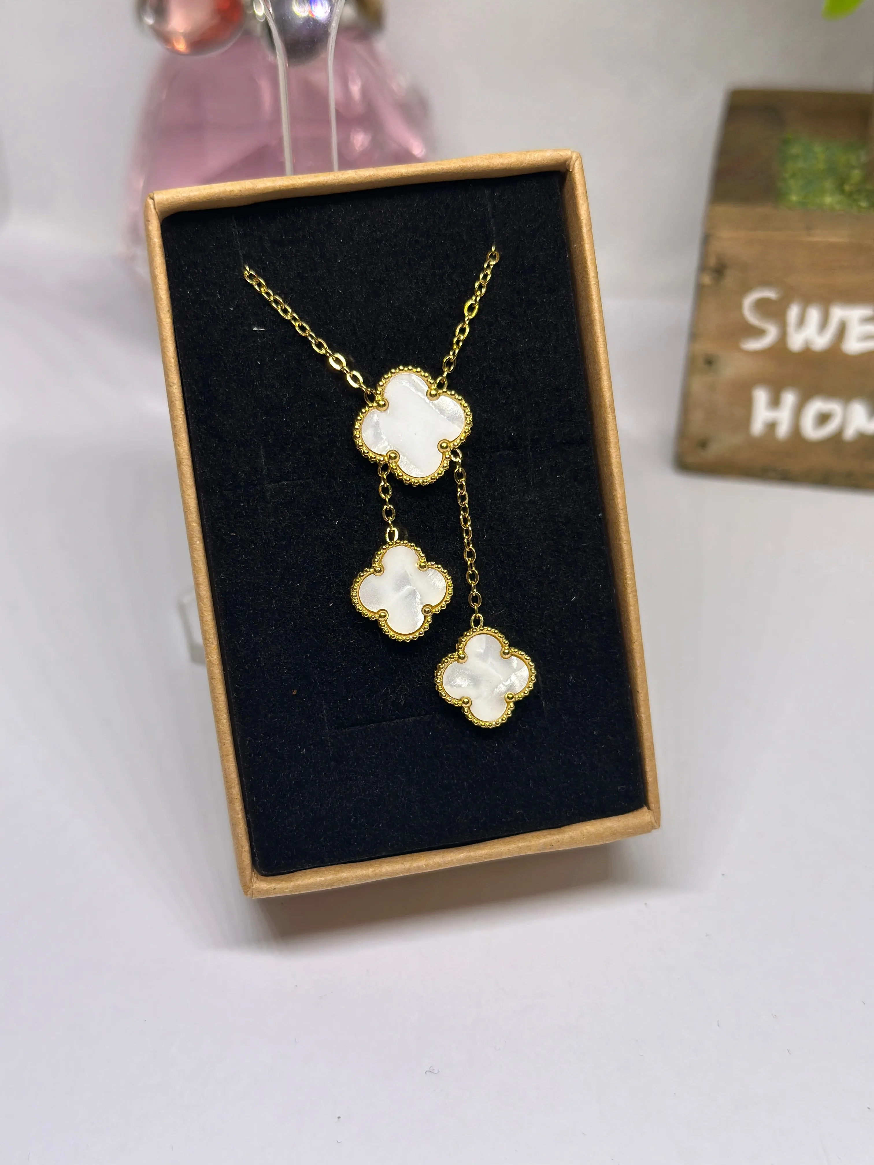 Golden clover necklaces